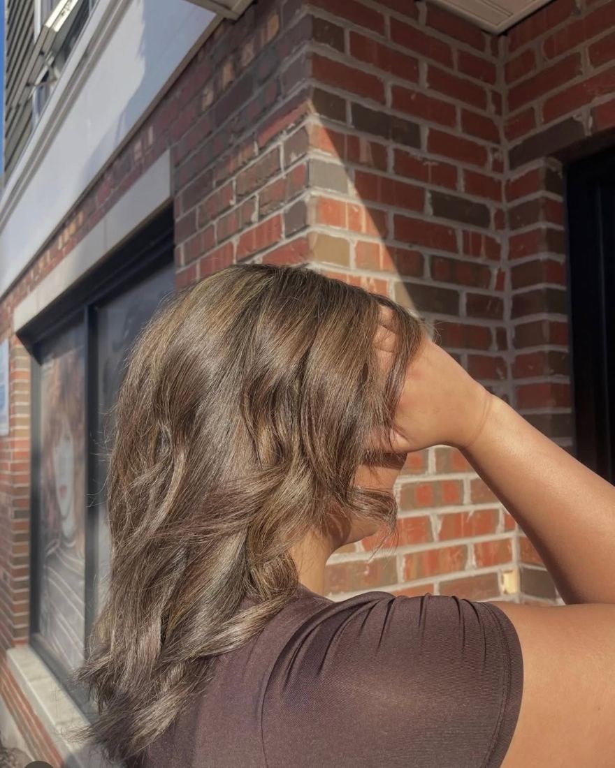 Brunette waves with sun-kissed highlights