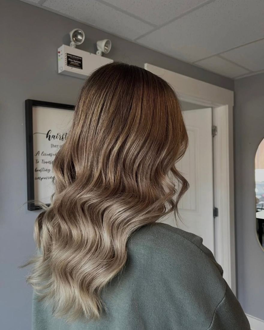 Long ash-blonde balayage on brunette hair